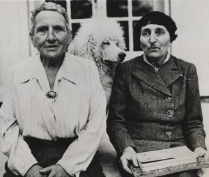 Carl Mydans, “Gertrude Stein, Alice B. Toklas and “Basket" in Culoz”, 1944, silver gelatin print on glossy fibre paper, printed c. 1944, 14,2 x 15,4 (16,5) cm, ©Unidentified Photographer, Courtesy: Daniel Blau, Munich