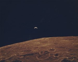 Apollo XII, ”Earth Rise Over the Moon“, November 19, 1969, c-print on glossy fibre paper, printed c. 1969, 19,5 (20,5) x 24,6 (25,8) cm, ©NASA Courtesy Daniel Blau Munich