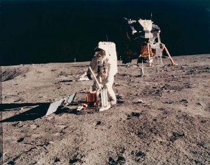 NASA · Apollo XI · Neil Armstrong, “Buzz Aldrin Deploying the EASEP on Surface of Moon”, July 20, 1969, color print on glossy fibre paper, printed in 1969, 19,3 (20,2) x 24,4 (25,5) cm, © NASA, courtesy Daniel Blau, Munich
