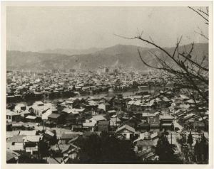 “Nagasaki Before Bombing”, before August 1945, silver gelatin print on glossy PE paper, printed later, 18,9 (20,2) x 24,1 (25,3) cm