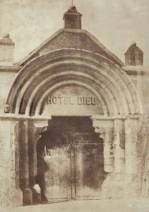Louis Alphonse Poitevin (1819-1882) "Portal of Hotel Dieu", c. 1840 - 1850 gold-toned salted paper print 36,0 (52,0) x 25,2 (40,2) cm