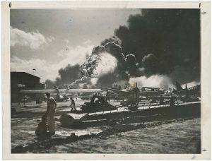 Unidentified U.S. Navy Photographer, "Pearl Harbor, Naval Air Station Ablaze", December 7, 1941