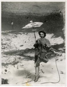 Unidentified U.S. American Photographer, "April Showers...? Raining Cat's 'n Dog's...Nope Catfish..! at Weeki Wachee Spring, Florida", c. 1960
